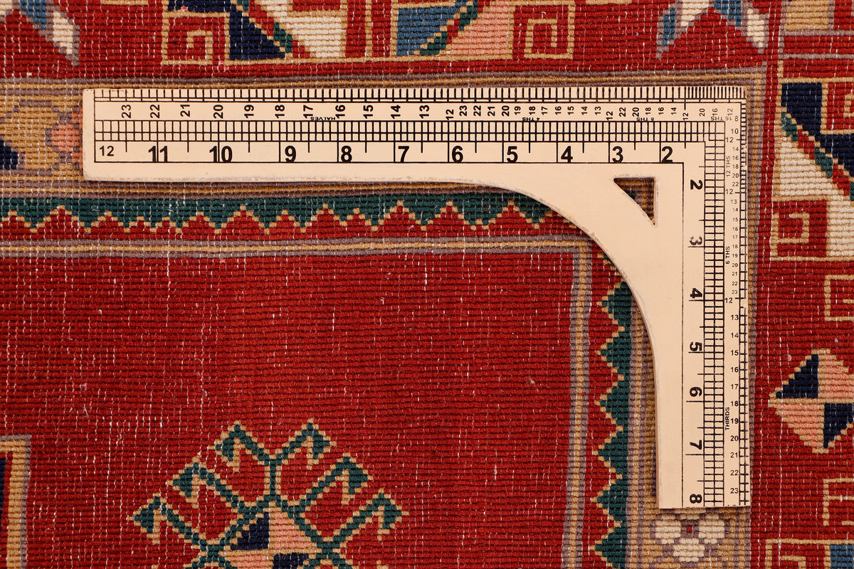 Red rug edge with cream border and measuring tape detail