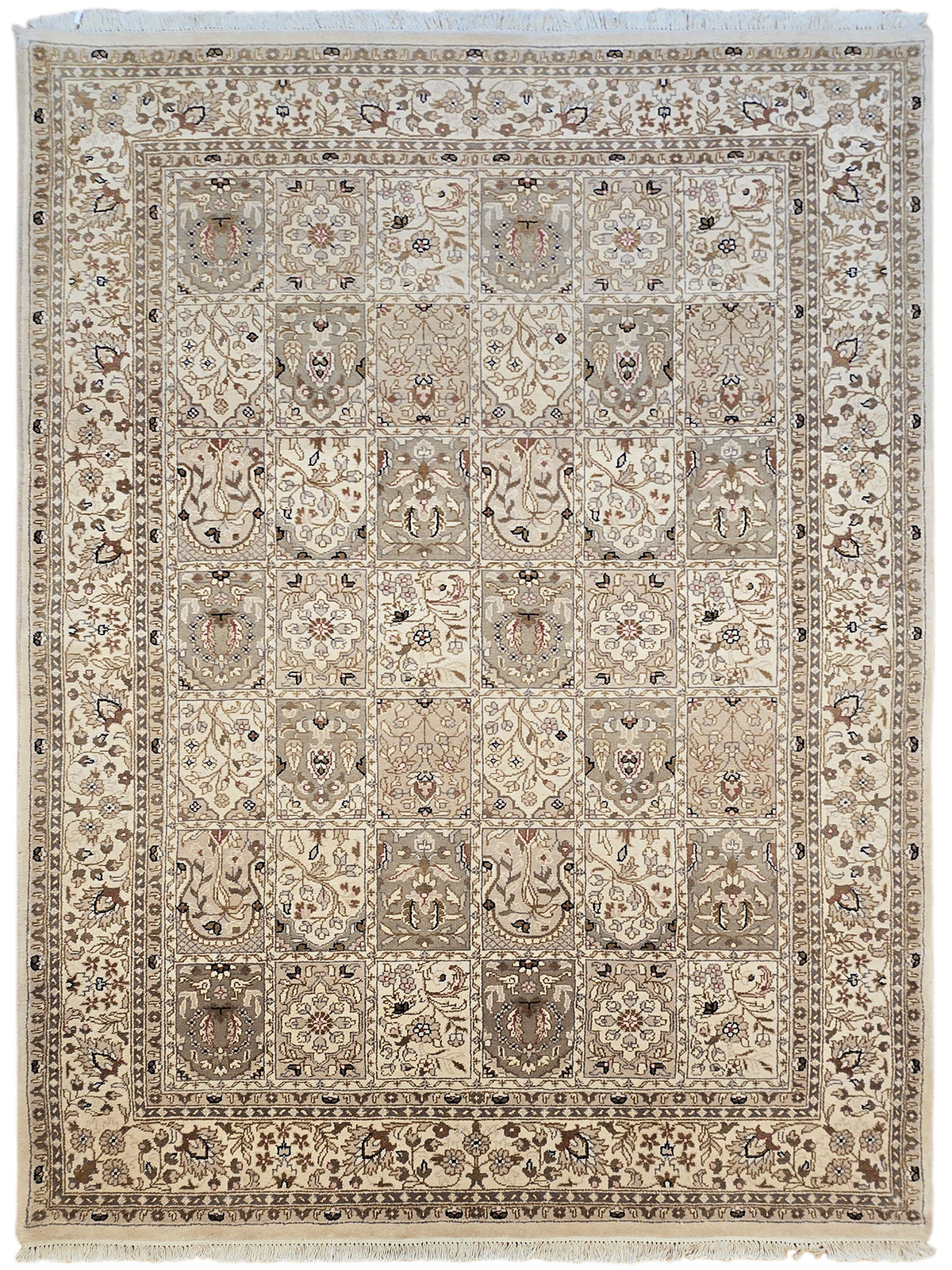 Bakhtiar rug with beige field, ornate medallion pattern and border, fringed edges.