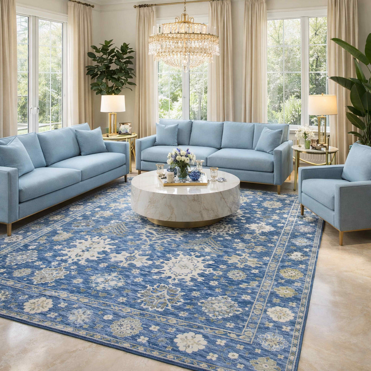 Oushak rug with blue border and cream scrolling floral pattern, laid flat on the floor