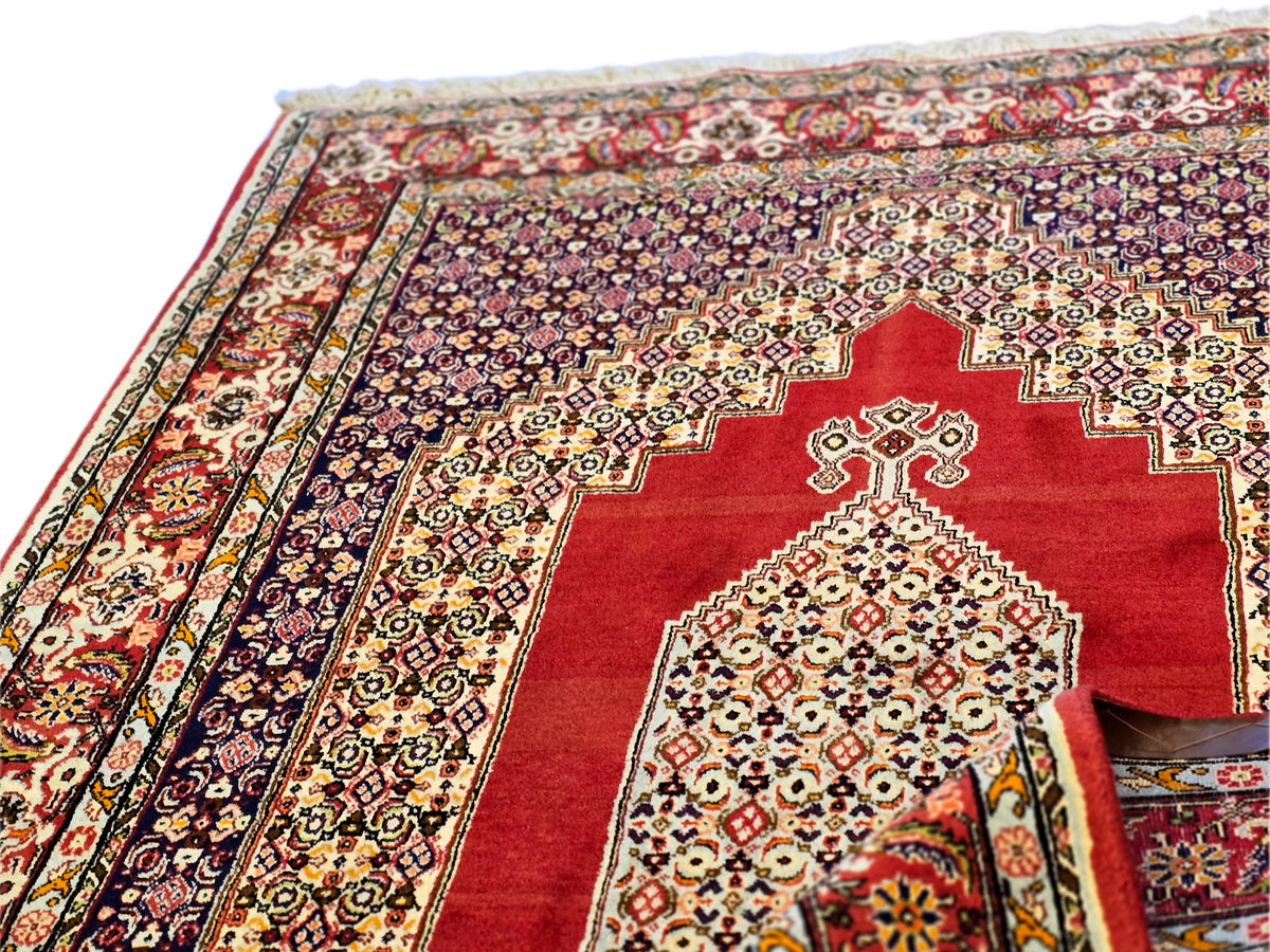 250x142 cm rug with red, navy, and cream geometric medallion patterns