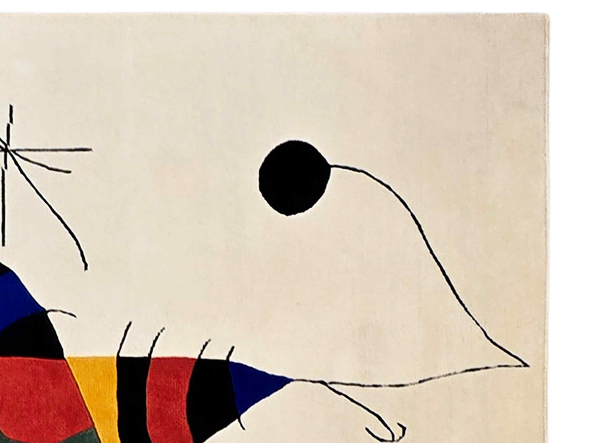 Abstract area rug corner with off-white field and line-drawn animal shapes