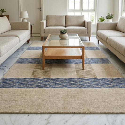 Handloom rug laid flat, beige with blue stripe bands and square accents