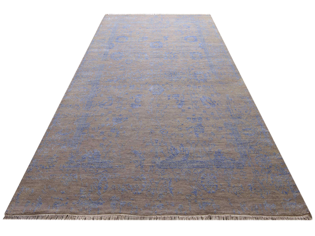 Full view blue and beige modern rug with abstract pattern and fringed trim