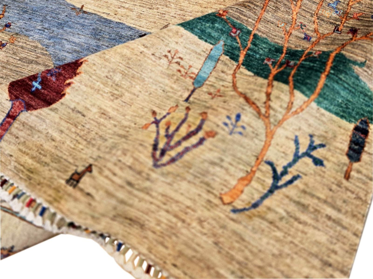 Ariana Gabbeh rug close-up with green and orange trees and multicolor dots