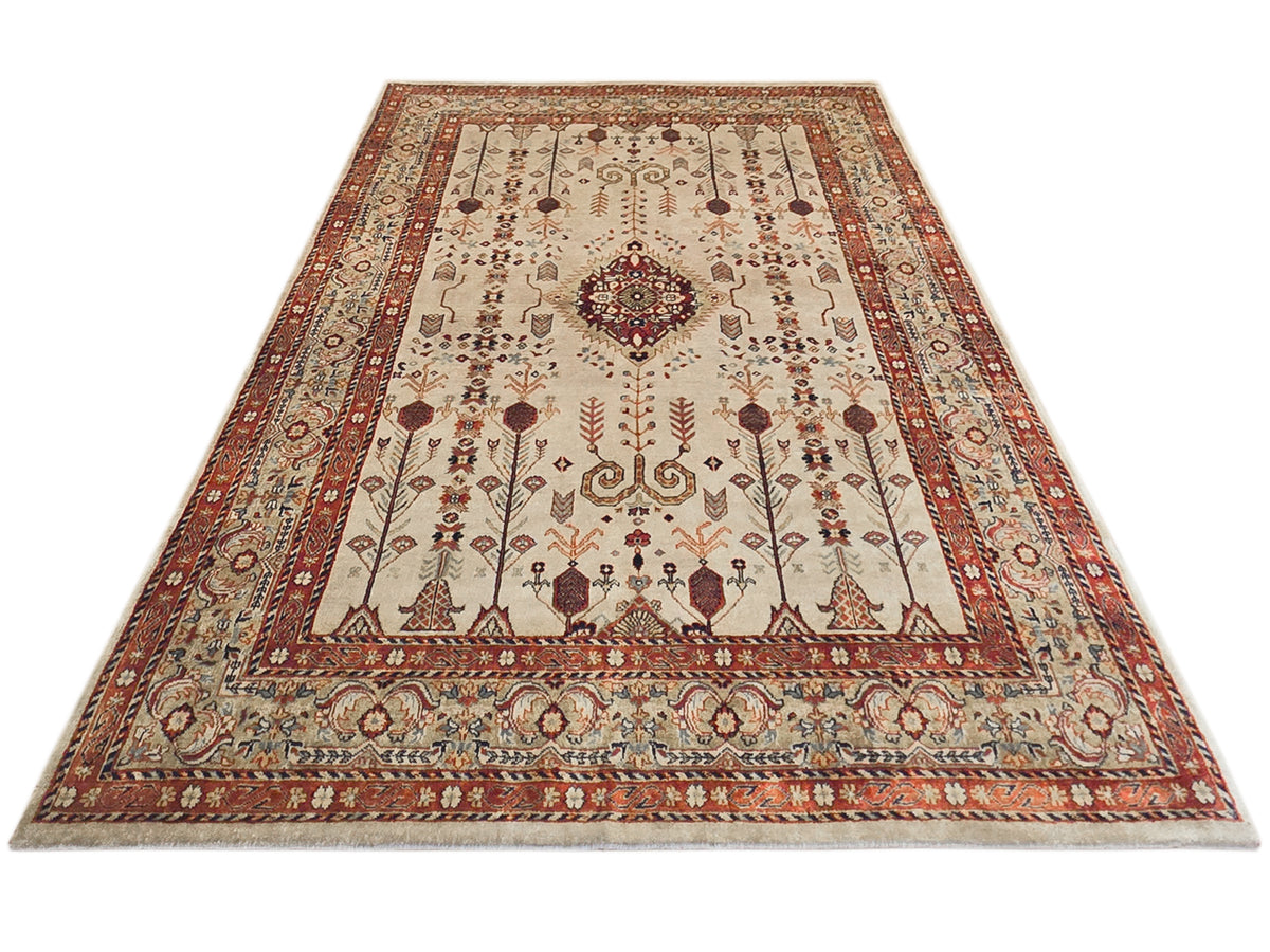 Rectangular rug with cream background, rust framing, and ornate medallion center