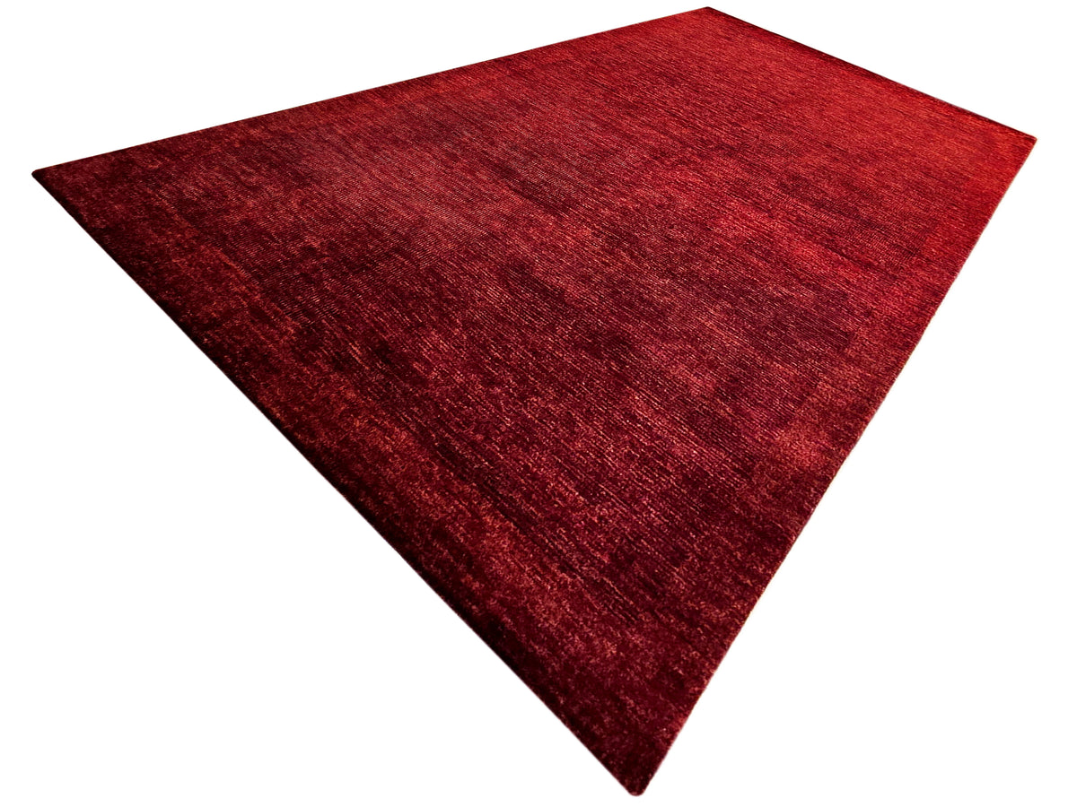 Red area rug with abstract texture, triangular view