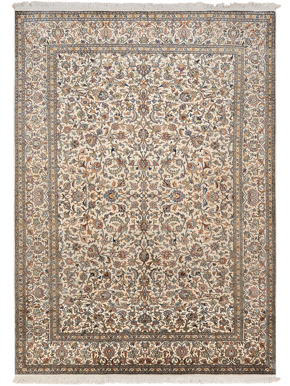 Beige silk rug with large medallion pattern, detailed border, and fringe trim