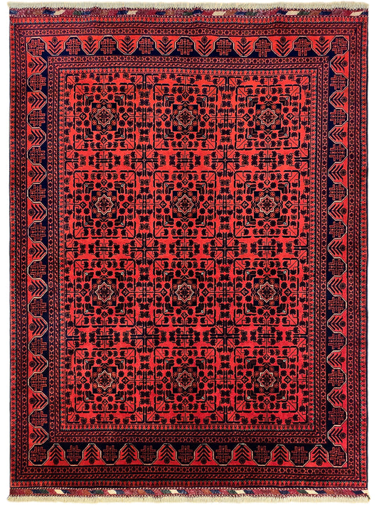 Red rug with dense navy medallion pattern and beige fringe border