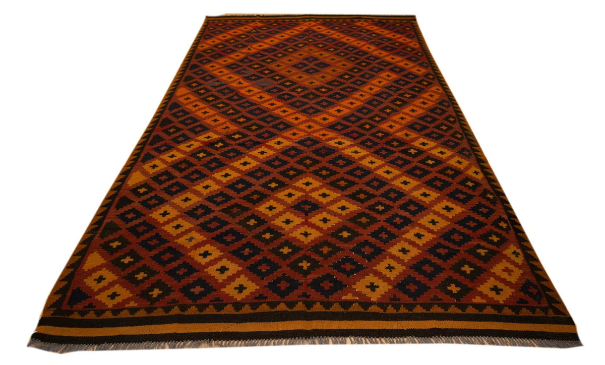 Kilim rug with geometric diamond lattice pattern, rust orange field and dark trim.