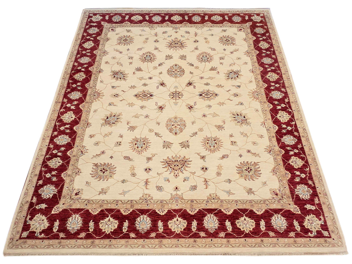 Cream wool rug with burgundy frame border and repeating floral rosettes