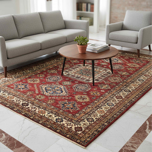 Red patterned area rug with central medallion and cream, blue, and gold accents