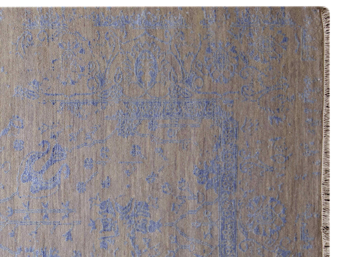 Detailed view of blue abstract rug pattern with textured woven surface