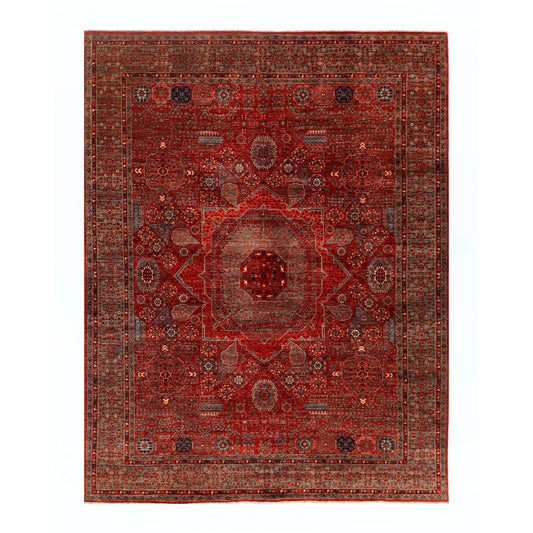 Mamluk rug with red field, central medallion, and detailed geometric border