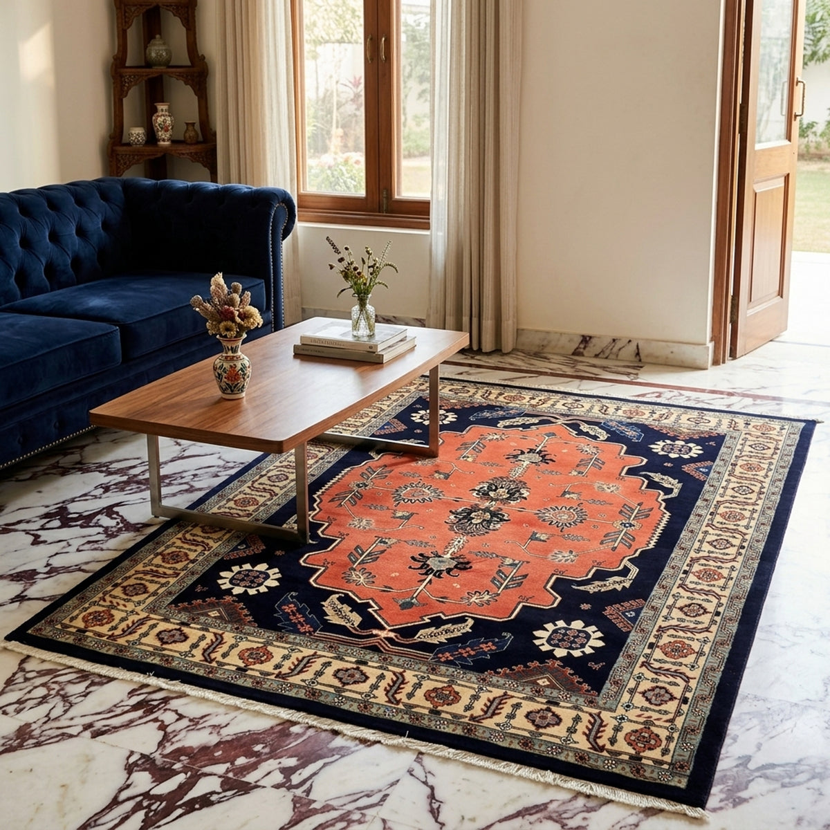 Rectangular ornate rug with orange center medallion, navy field, cream border and fringe
