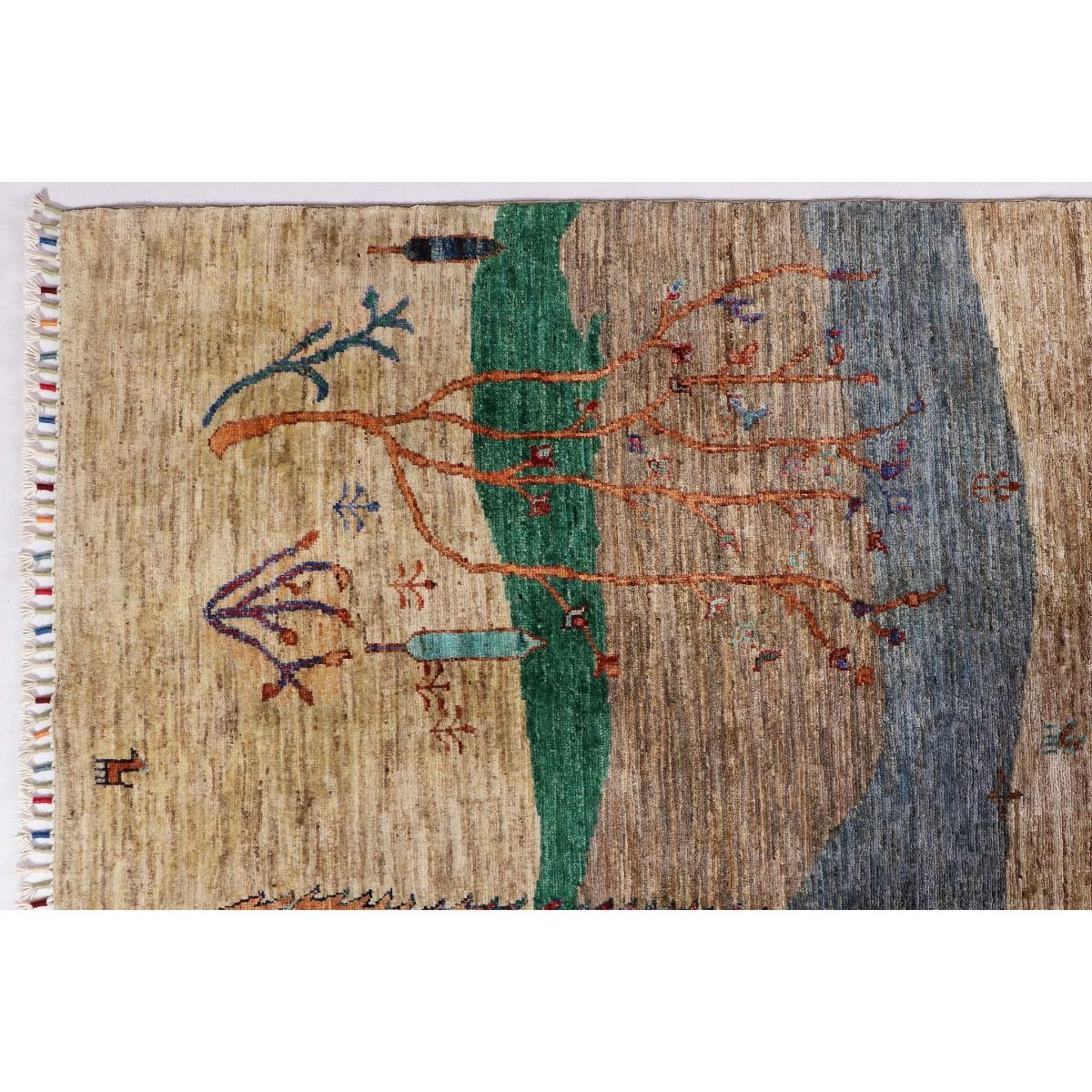 Ariana Gabbeh rug close-up with bordered trees and multicolor stitched details