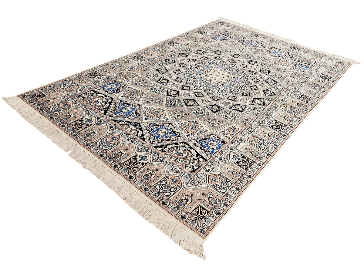 Beige and blue geometric rug with central medallion, detailed field, and fringed corners.