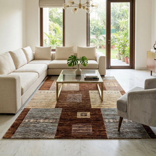 Geometric patchwork area rug in brown, beige, and gray with rectangular blocks