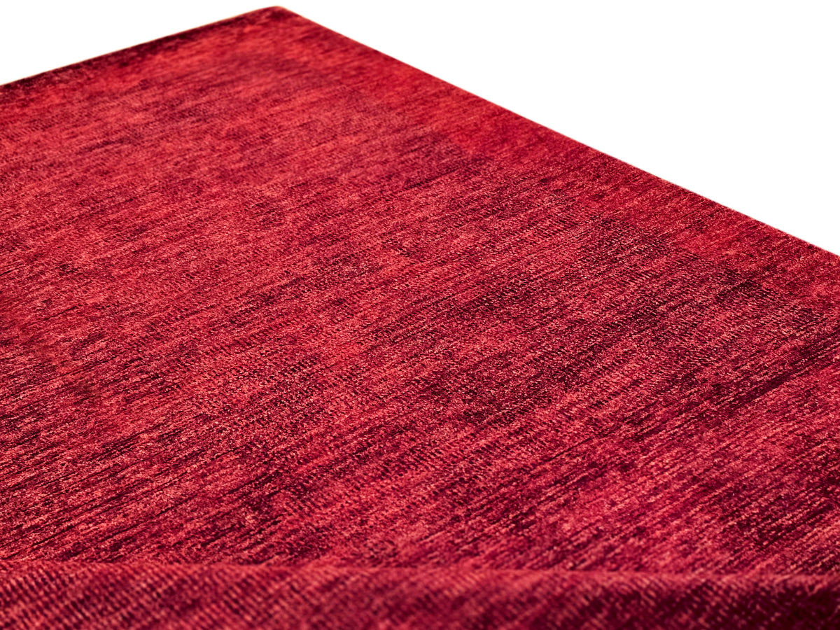 Red rug texture close-up with fine abstract pattern