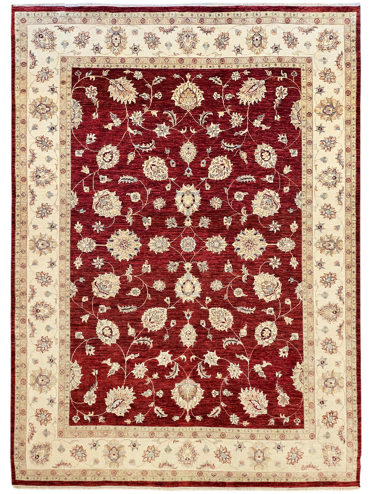 Red area rug with cream border and centered ornate floral medallion
