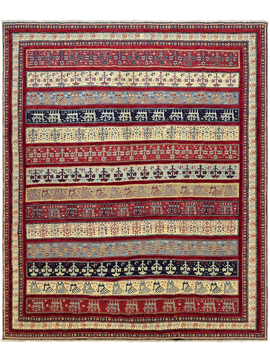 Patterned rug with alternating red, blue, cream, and gold decorative rows