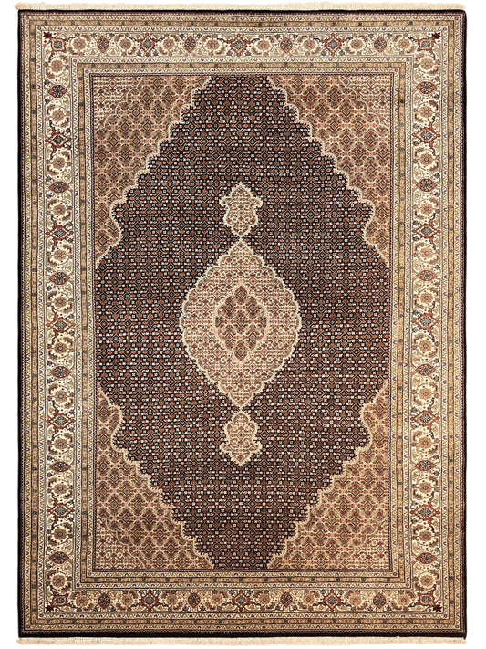 Tabriz mahi rug with brown field, cream diamond medallion, and red-brown edge border