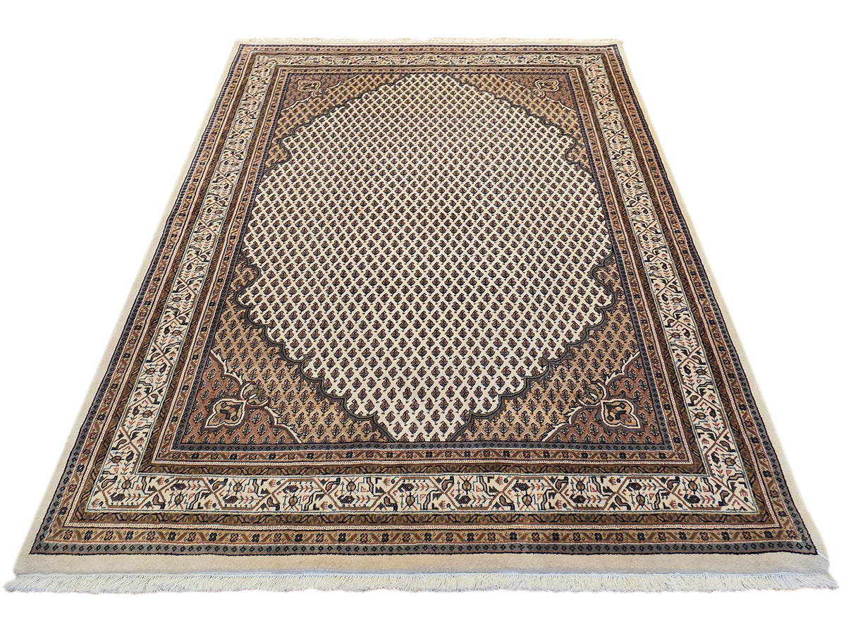 Square geometric area rug with dark brown center, ivory grid field, and fringed hem
